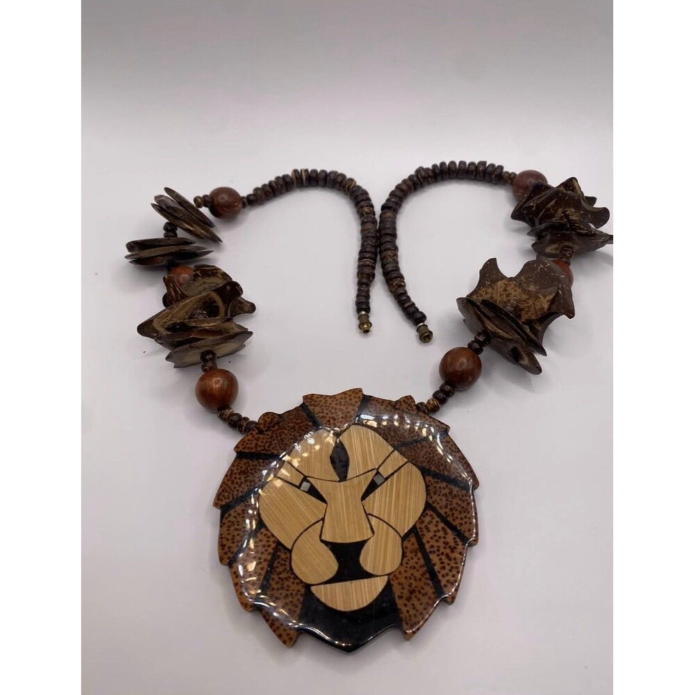 Wood Beaded Necklace by designer Lee Sands . Lion Face Animal Charm Pendant, by
